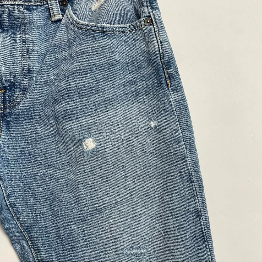 LEVI’S 511 distressed jeans